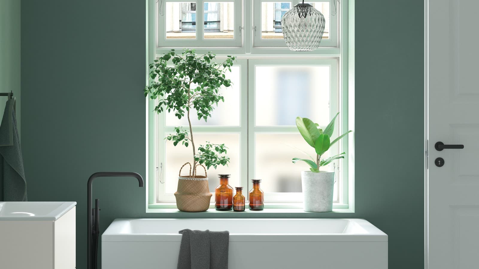 Vihreä väri tuo luonnonläheisyyttä kylpyhuoneeseen. Vihreä väri tuo luonnonläheisyyttä kylpyhuoneeseen.